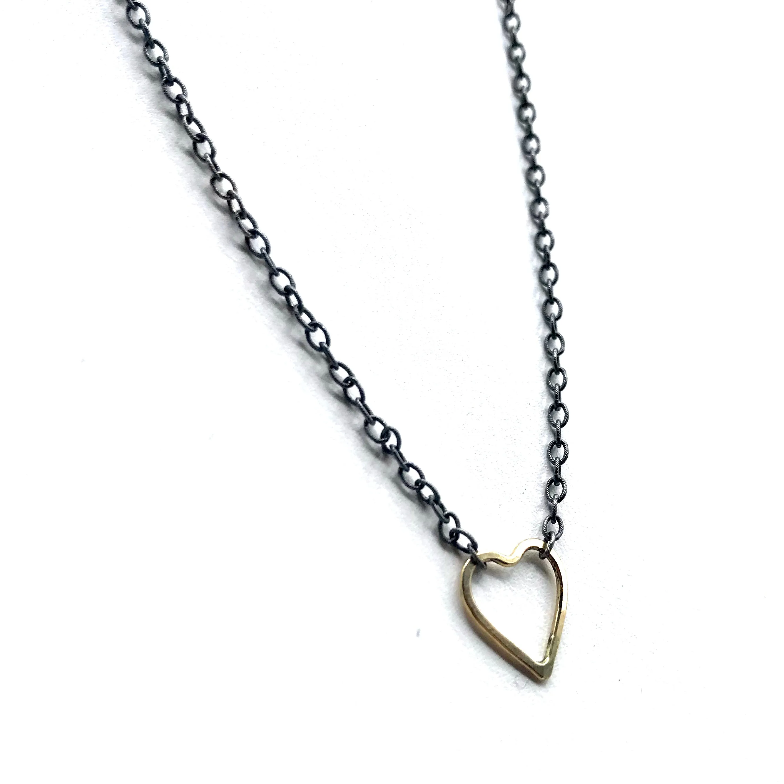 Golden Heart on a Blackened Chain