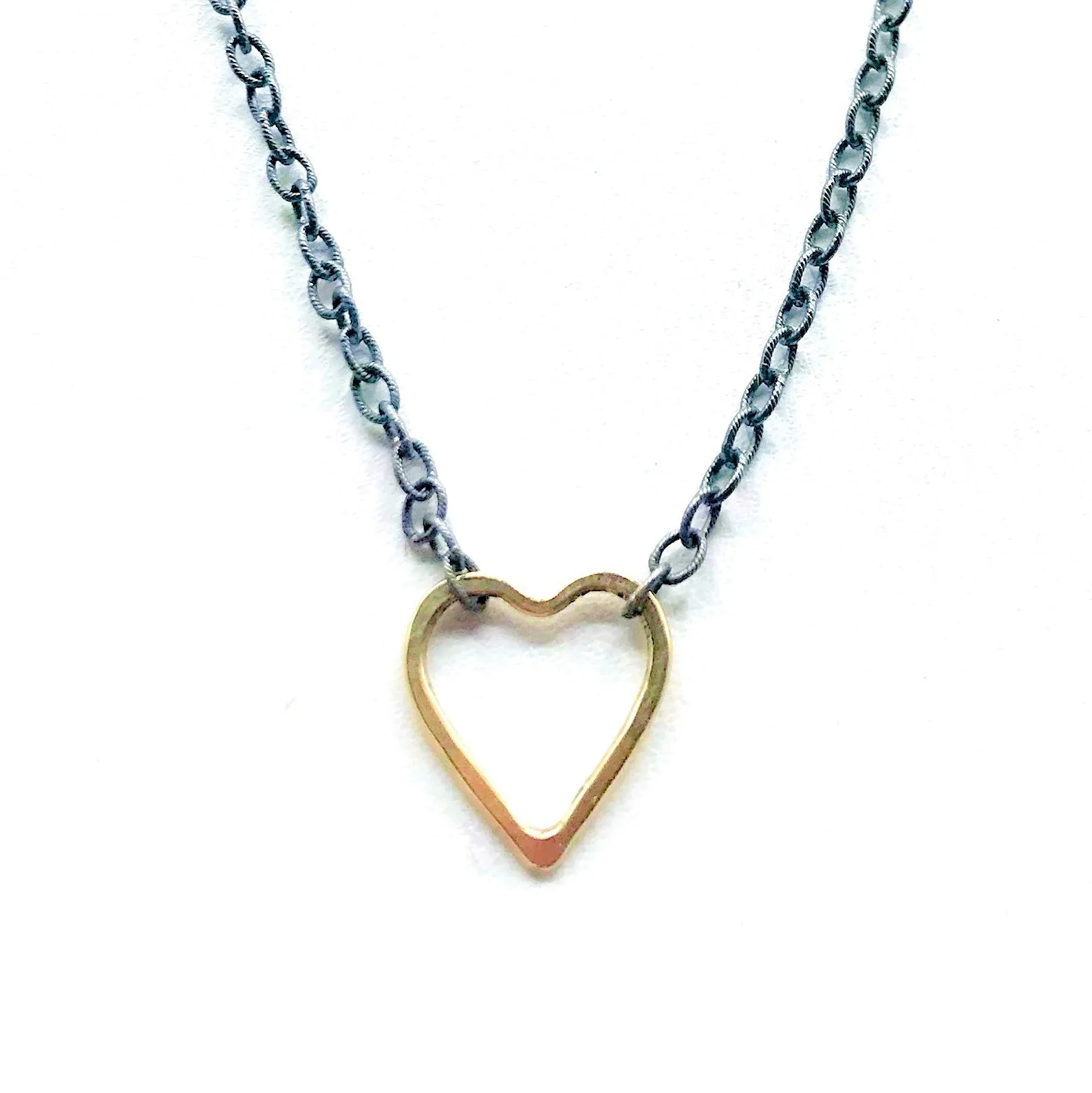 Golden Heart on a Blackened Chain