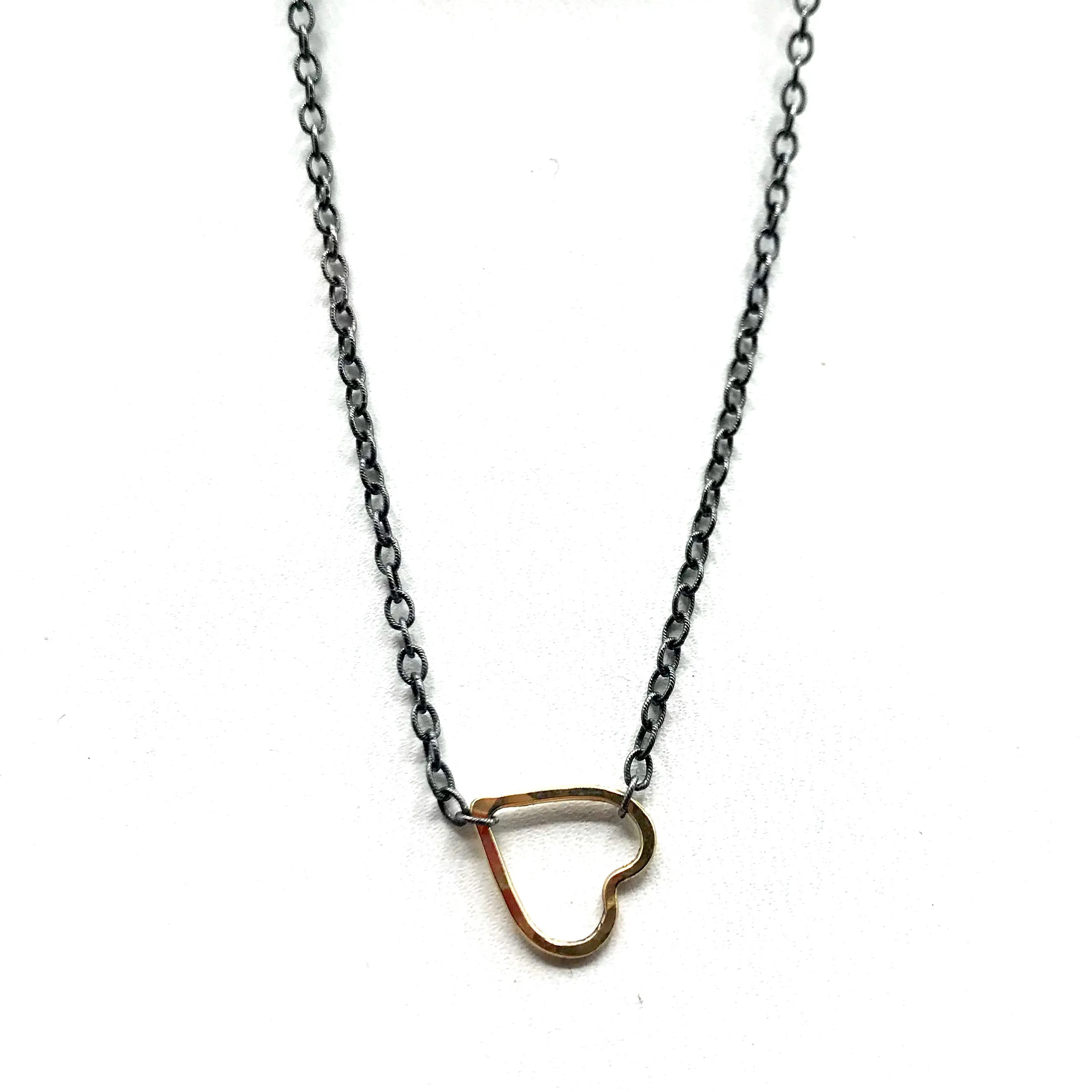 Golden Heart on a Blackened Chain