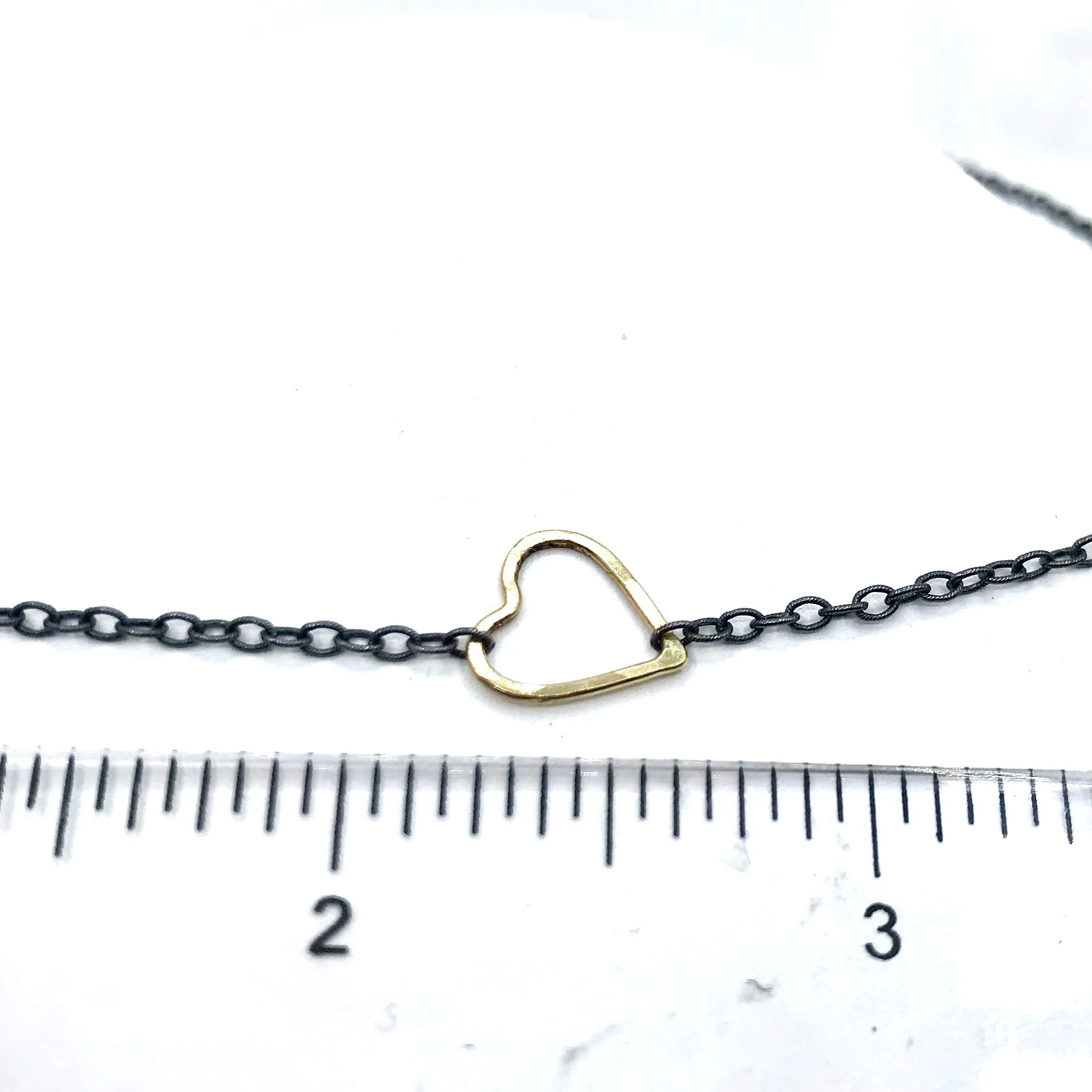 Golden Heart on a Blackened Chain