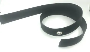 Harness webbing with a grommet in the middle