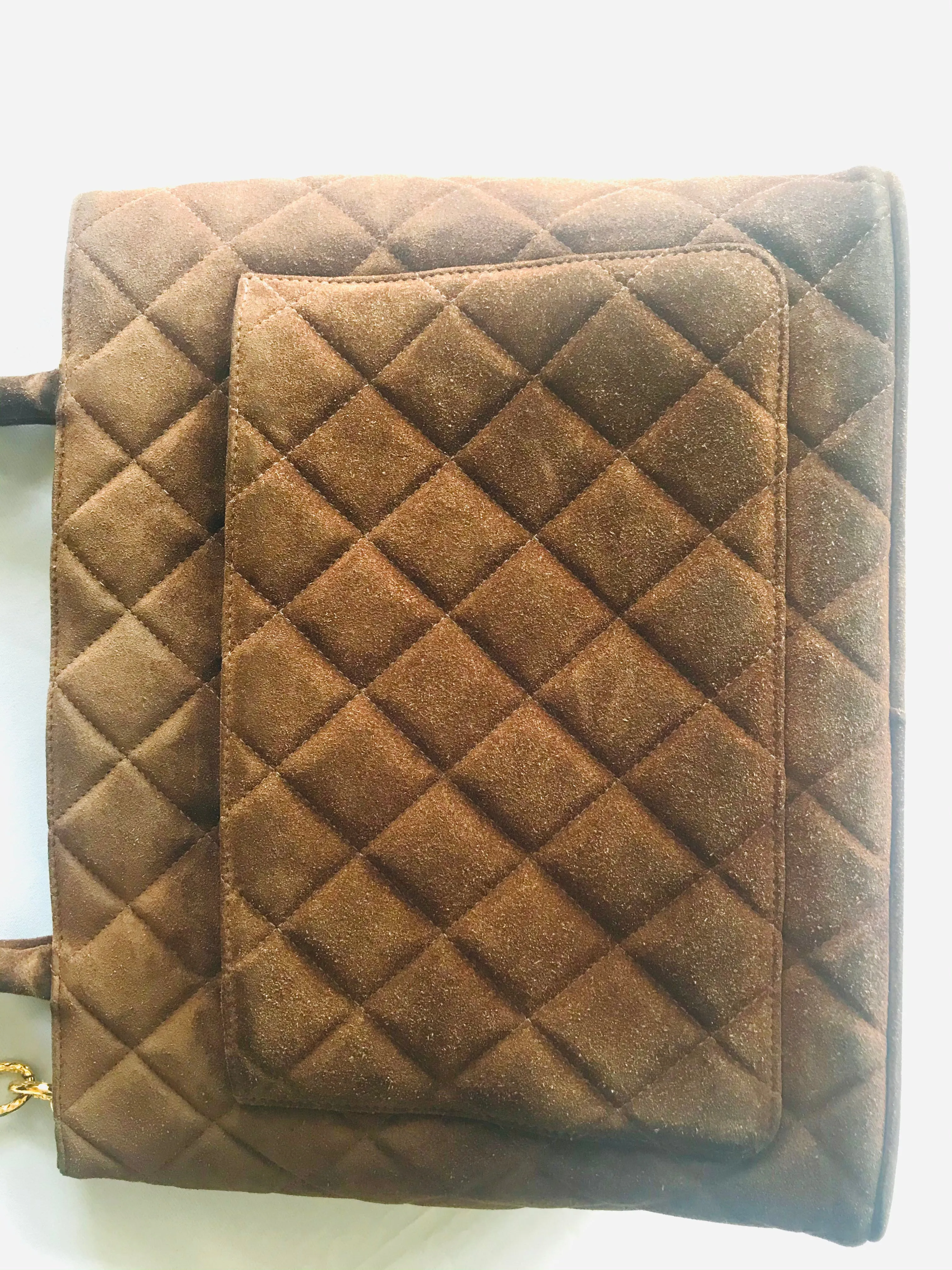 Vintage CHANEL brown suede classic tote bag with large CC mark and golden CC medal charm to the zipper. Classic purse for daily use.