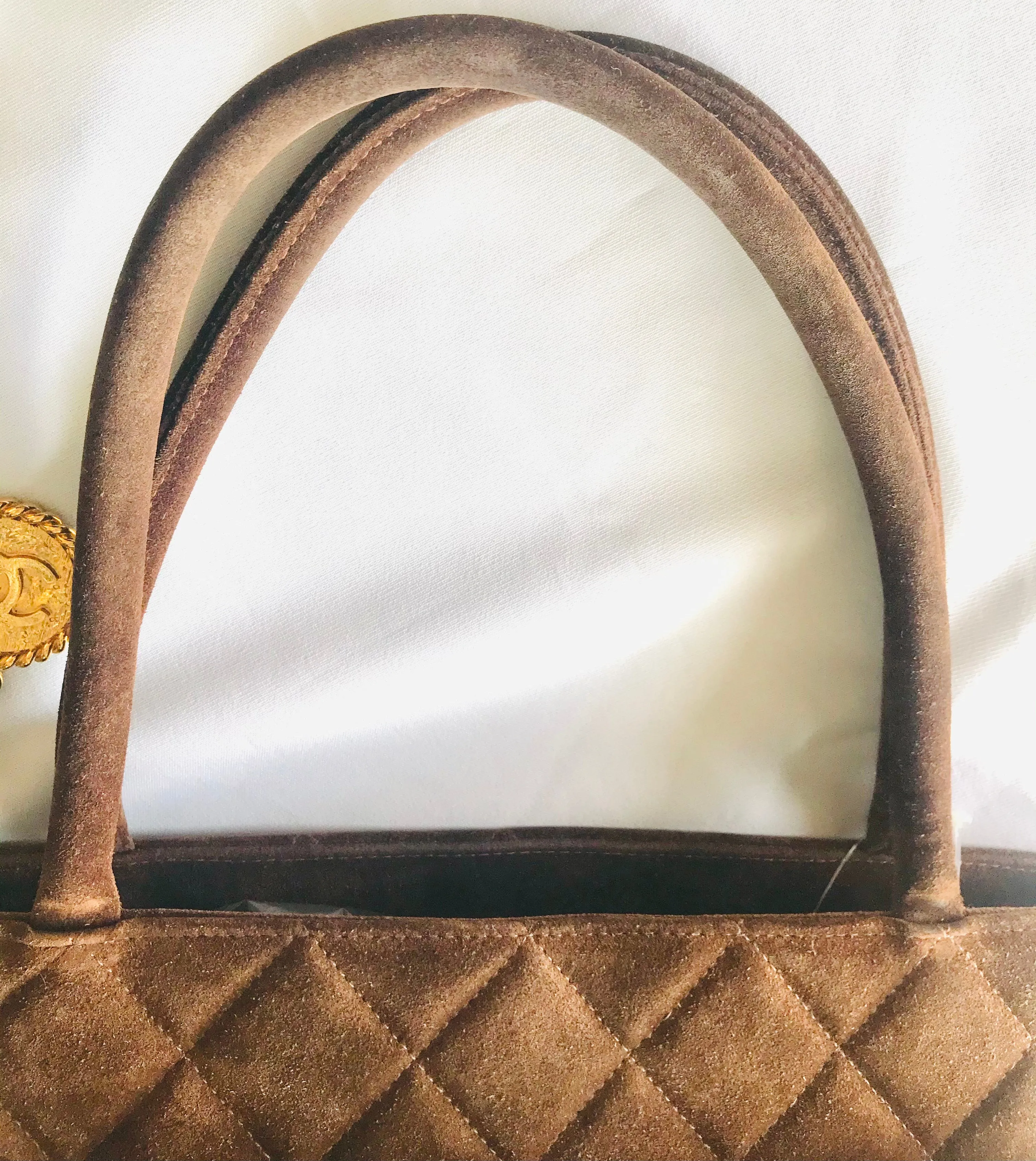 Vintage CHANEL brown suede classic tote bag with large CC mark and golden CC medal charm to the zipper. Classic purse for daily use.